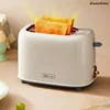 Home toaster. Can heat slicing bread and function as a sandwich breakfast machine. A small automatic oven 1