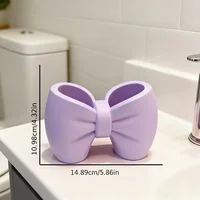 A desktop decoration item, shaped like a macaron-colored bow, can be used as a pen holder. 2