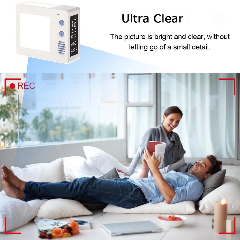 A man lies on a sofa with a woman standing next to him holding a tablet. The image demonstrates the clarity of the displayed screen. Text reads "Ultra Clear: The picture is bright and clear, capturing every small detail." Experience this vivid detail with 1080P HD Recording for unmatched quality using the Night Light Clock SpyCam.