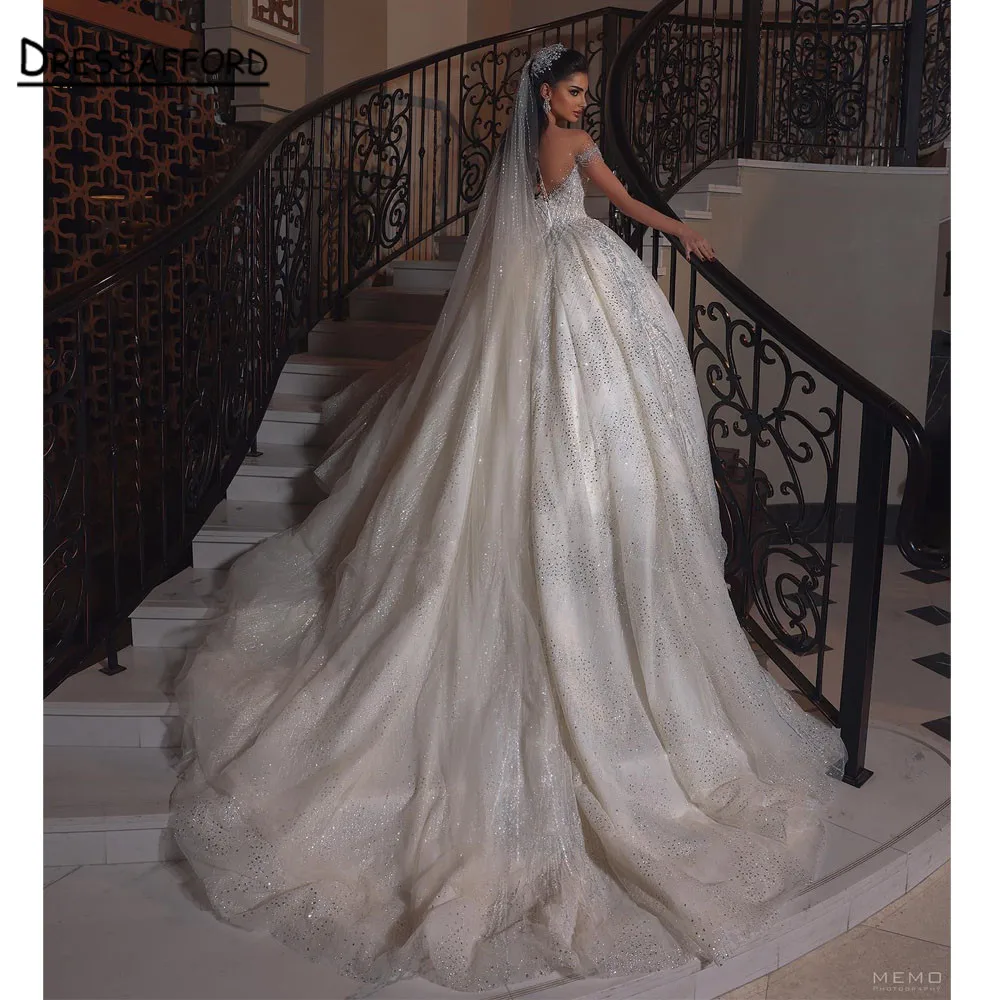 

Sparkly Crystal Illusion Cape Sleeves Dubai Wedding Dress Ball Gown Sequined Appliques Lace Saudi Arabic Bridal Gown
