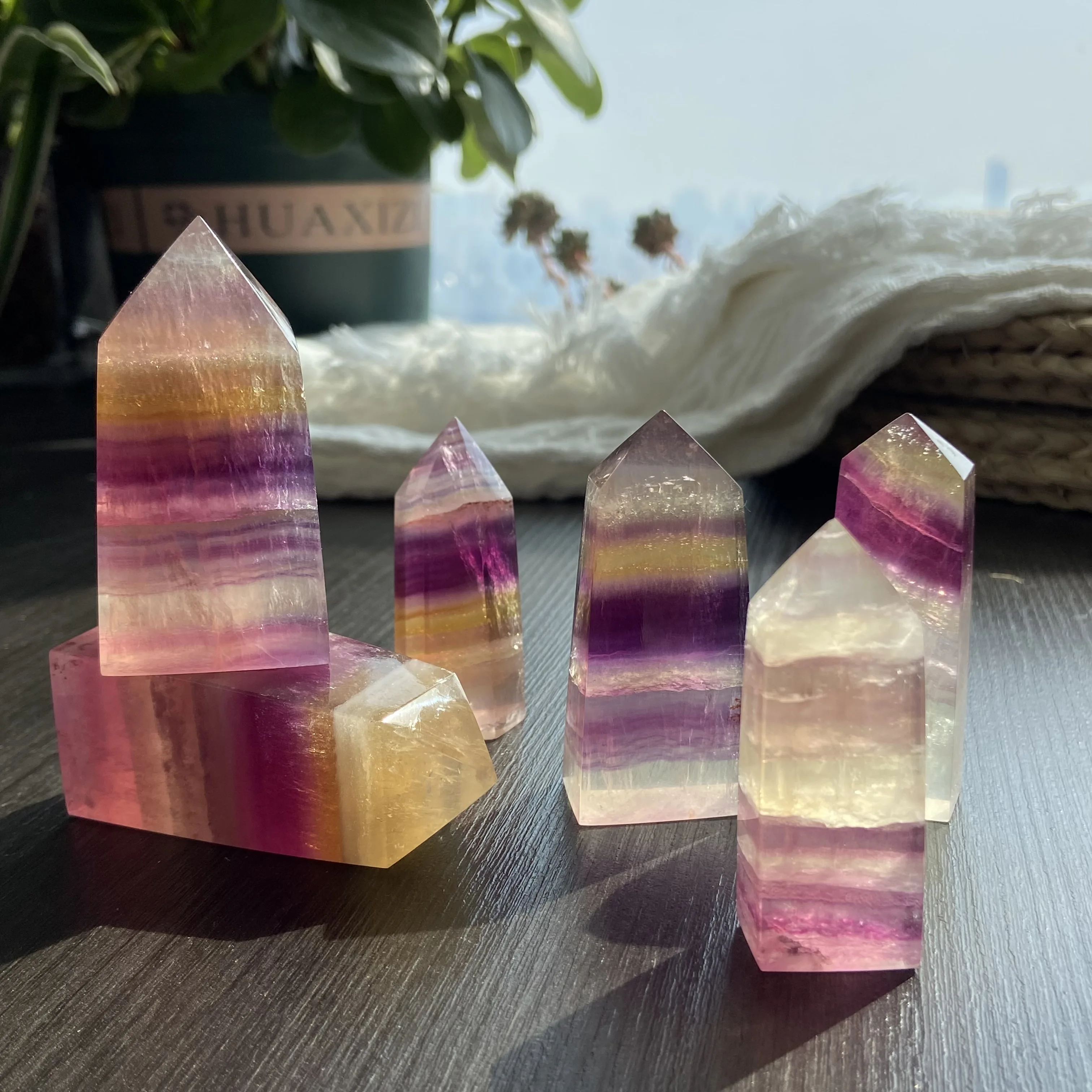 

Natural colored candy fluorite crystal column point tower ornaments original stone specimen single-pointed hexagonal