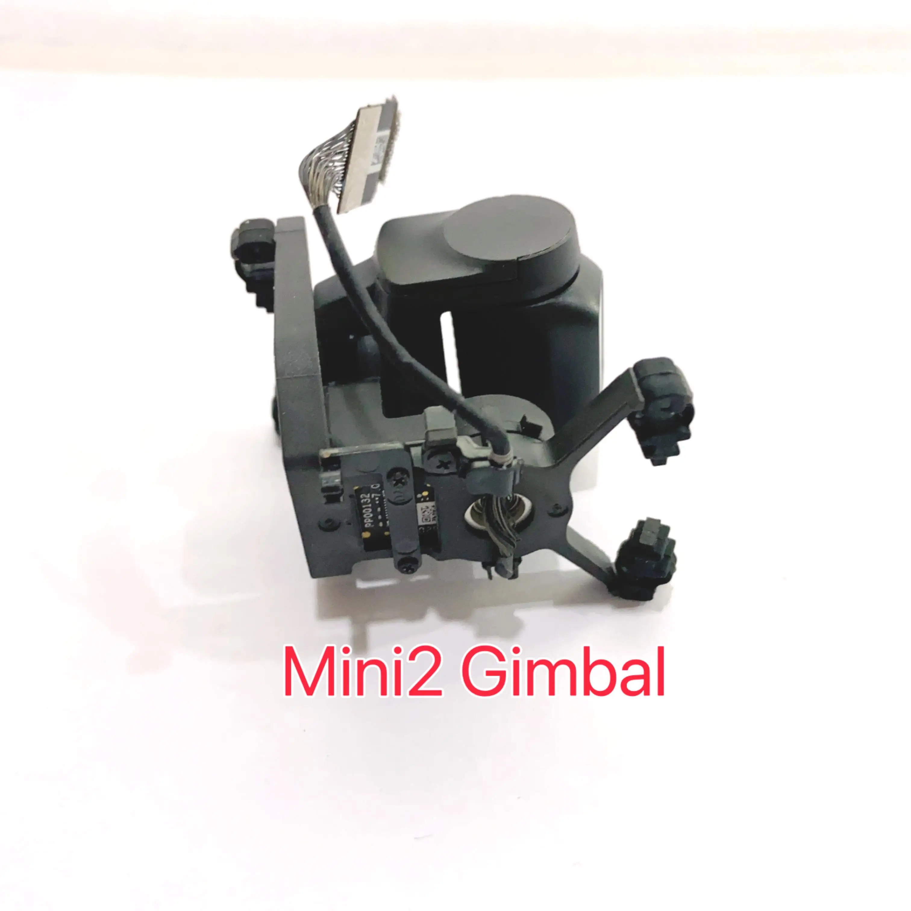 Cardan avec caméra pour DJI Mini 2, pièce de réparation drone, incliné pour montrer les connecteurs.