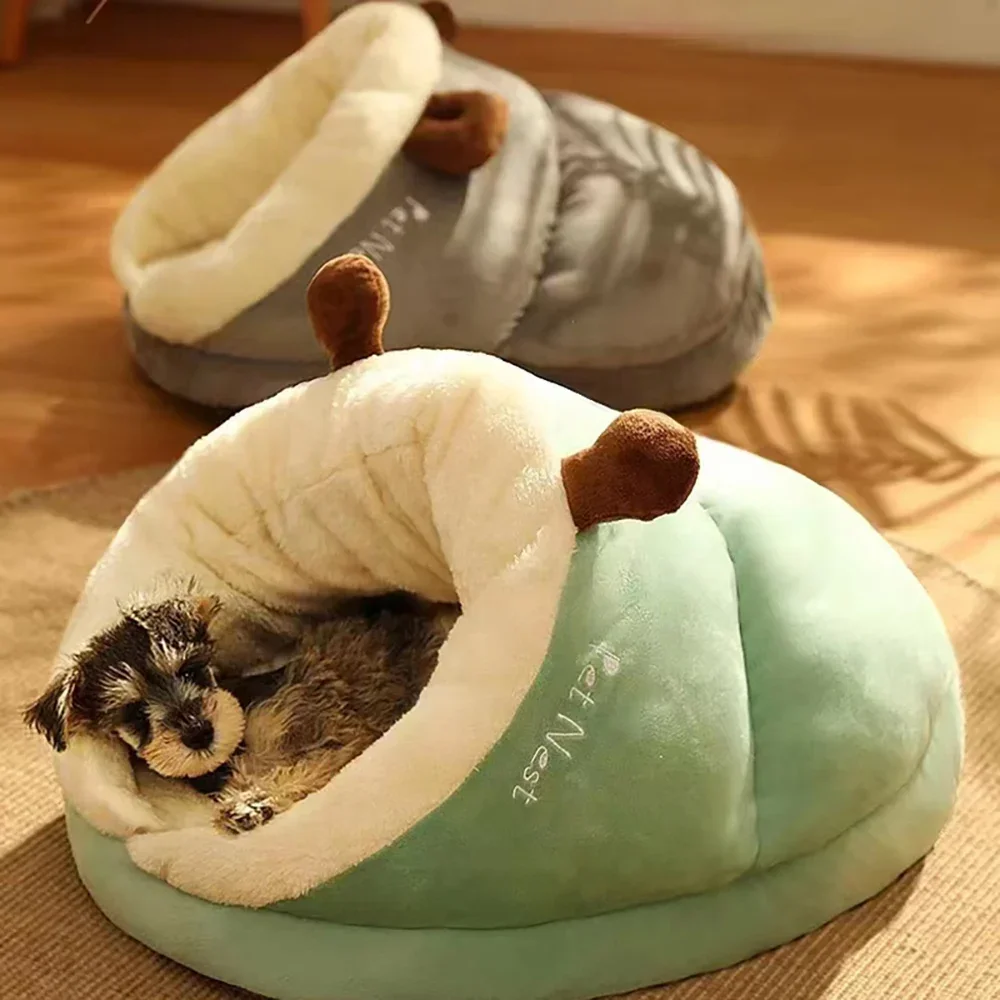 Two Warm Pet Beds in grey and sage green; a small terrier puppy is seen sleeping comfortably inside the green bed.