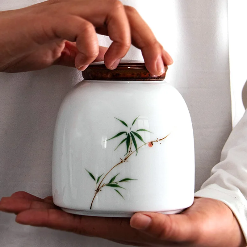 

Hand-painted Bamboo Leaf Lotus Ceramic Storage Jar with Lid Sealed Tea Tin Exquisite Porcelain Candy Jar Food Storage Box Crafts