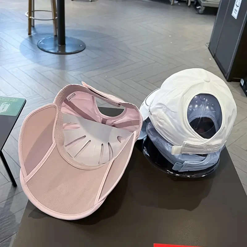 Women's adjustable ponytail hat in a light color.