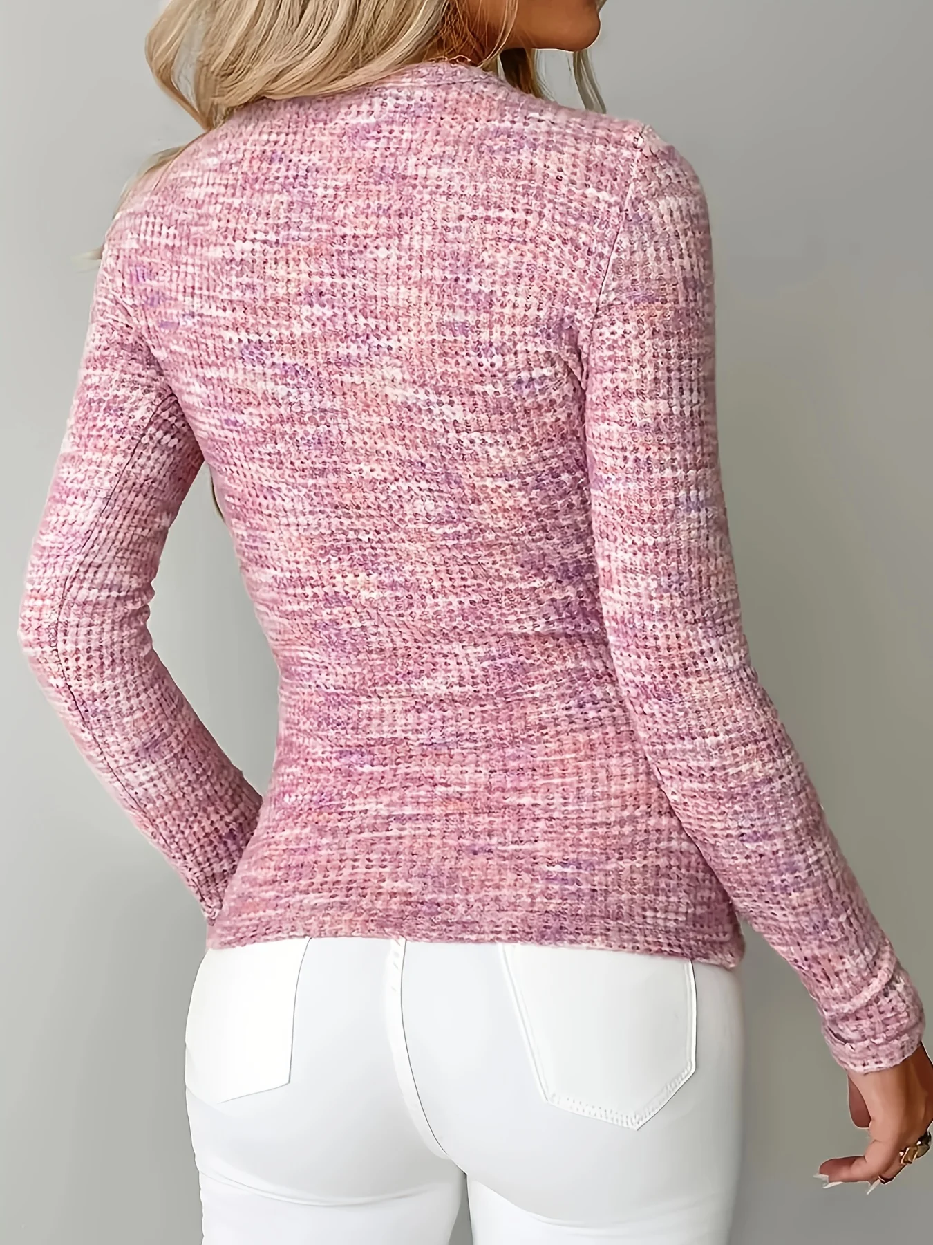 A stylish, versatile, form-fitting, and sensual women’s pullover top with a zipper at the neckline. 2