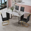 Table and chair set. 1 table and 4 black PU cushioned golden color leg chairs. White imitation marble tabletop MDF table legs w 1