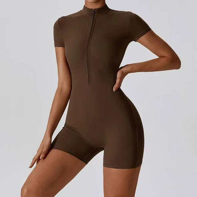 Women’s brown short-sleeve yoga romper with fitted design and front zip collar