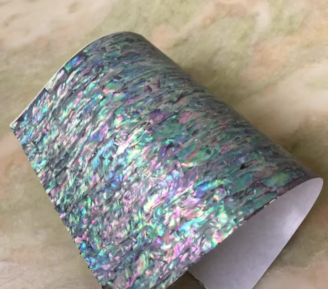 

Size:14x24cm Thick:0.25mm Colorful abalone shell veneer Comes with adhesive backing DIY decoration of fishing rod handicrafts