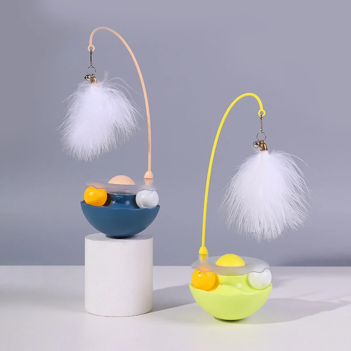 Interactive cat rolling toy ABS base with feather rolling ball anti tipping design for cat play toy