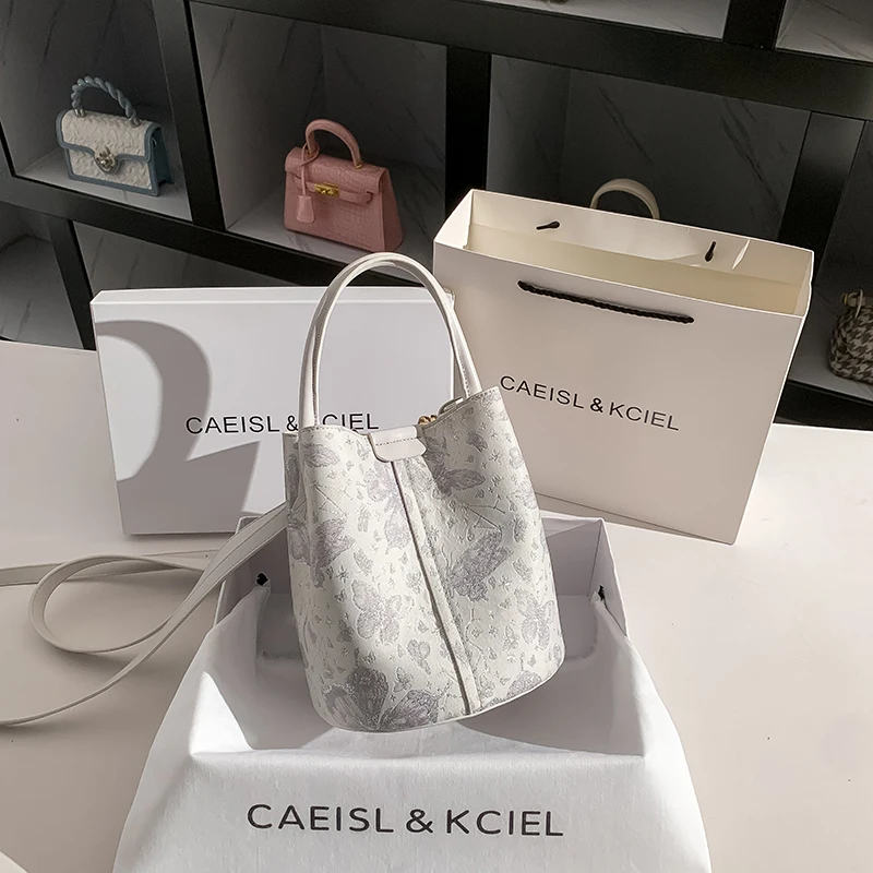 حقيبة يد دلو بتصميم طباعة أزهار أنيقة، بتصميم حمل...