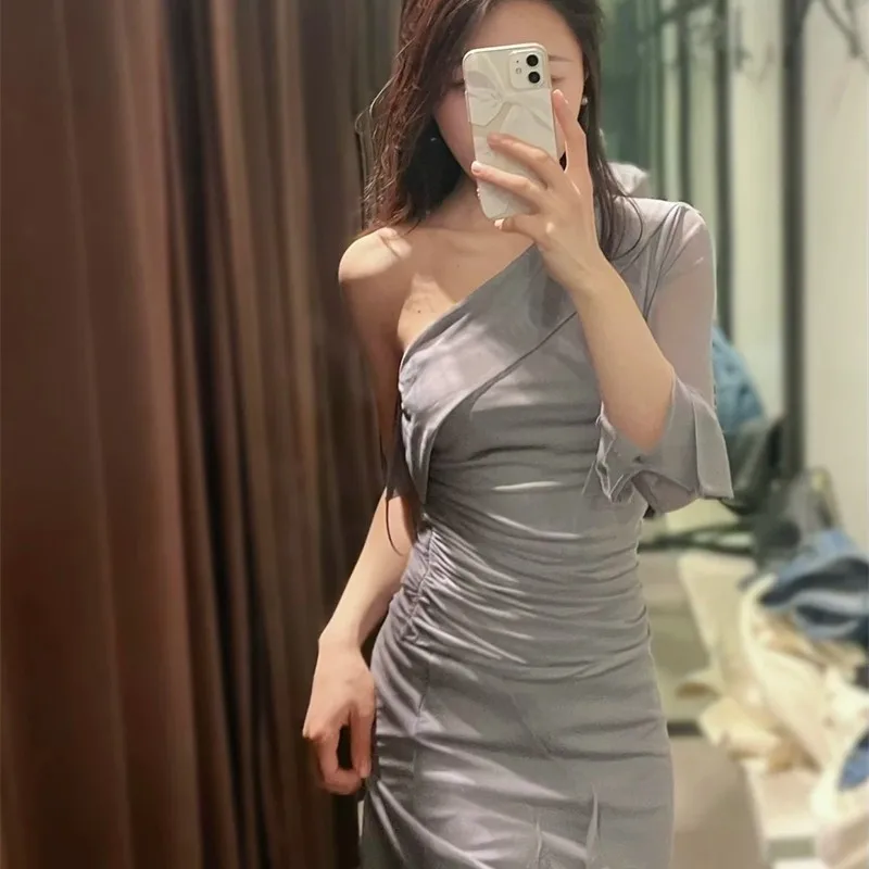 

2023 spring new women's clothing design sense ruffled asymmetric off-the-shoulder slim tulle top