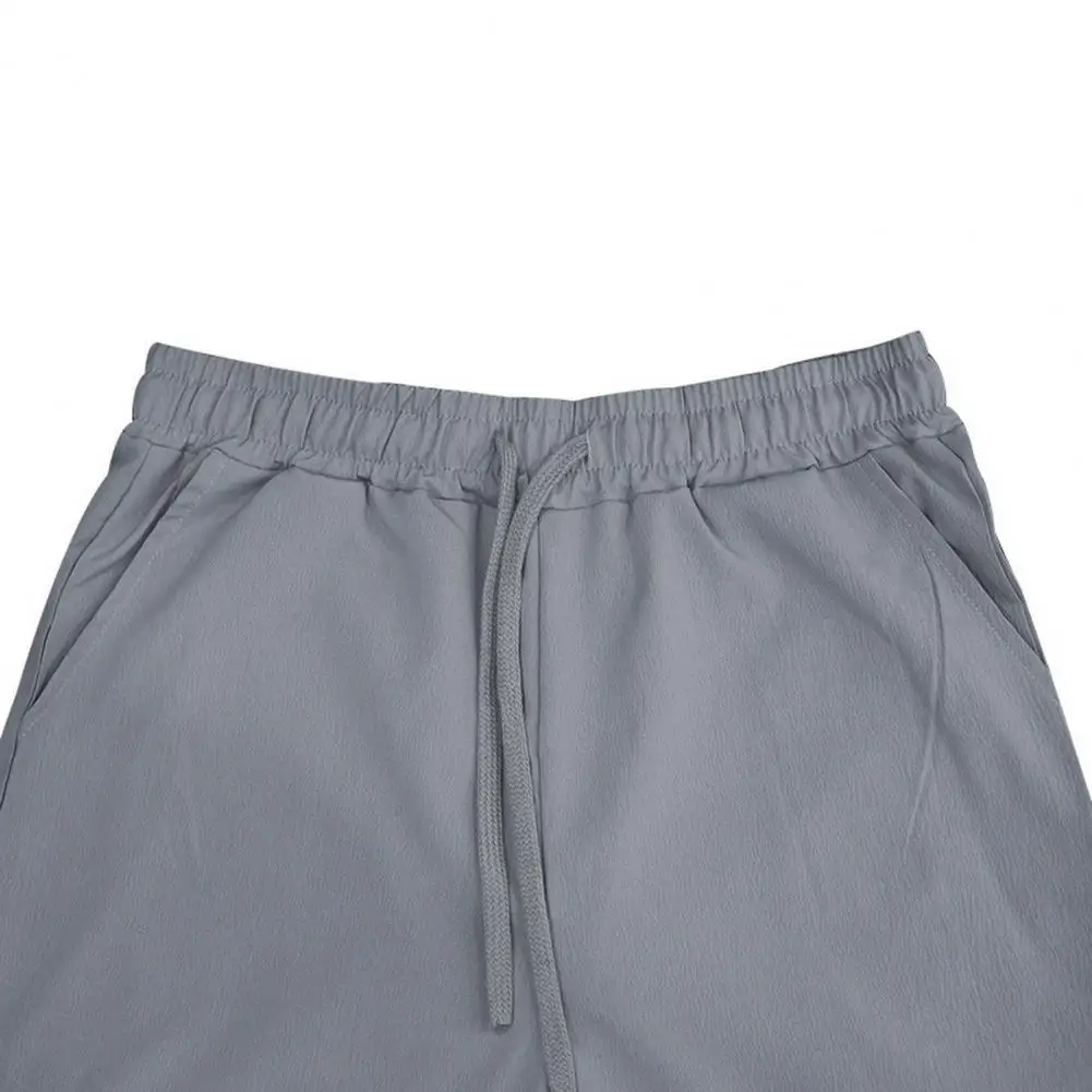 Description Picture 3 of itemMen Casual Trousers Men's Wide Leg Drawstring Pants with Elastic Waist Pockets for Casual Sports Wear Loose Fit for Comfort