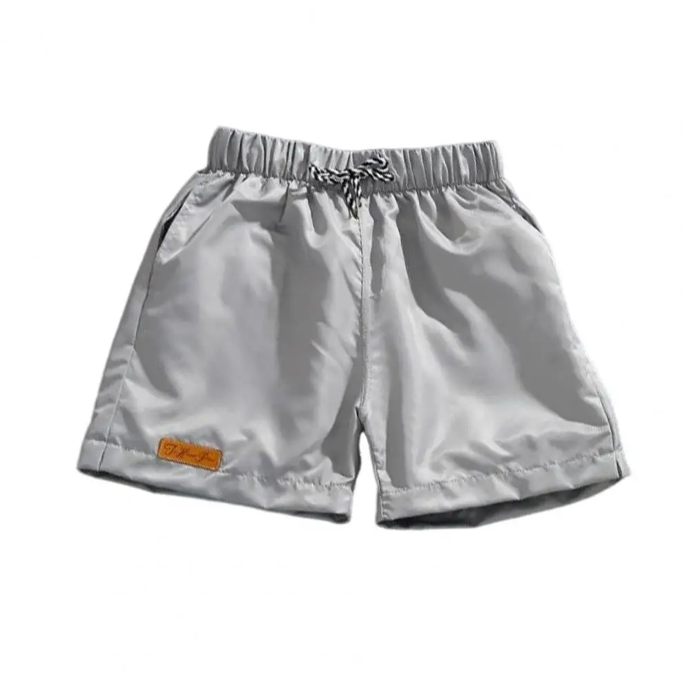 

Shorts Men's Elastic Waist Drawstring Beach Shorts with Pockets Wide Leg Surf Sports Shorts for Summer Logo Print Solid Color