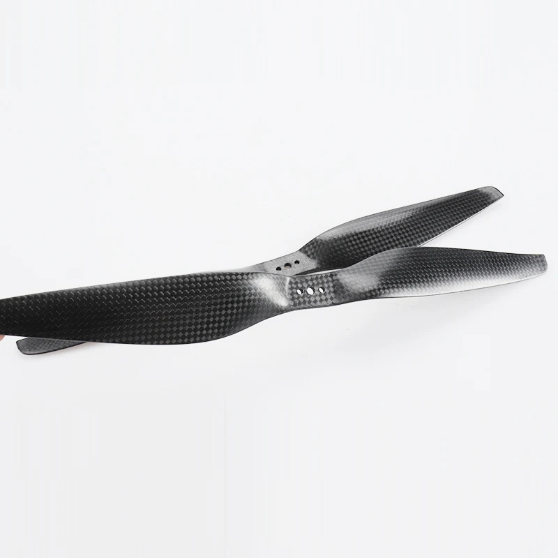 Hélices et moteurs pour drone en vert et jaune, compatibles DJI, avec un drone en arrière-plan.