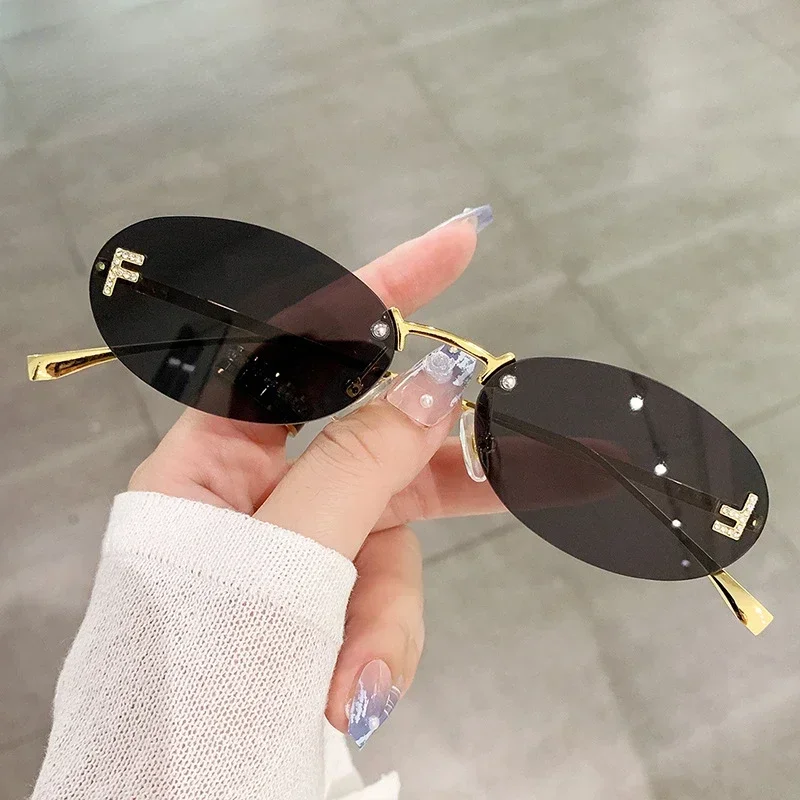 

2024 Cat Eye Sun Glasses Female Outdoor Shopping Shades Rimless Driving Eyewear Glasses Retro Letter Oval Sun Glasses Shades