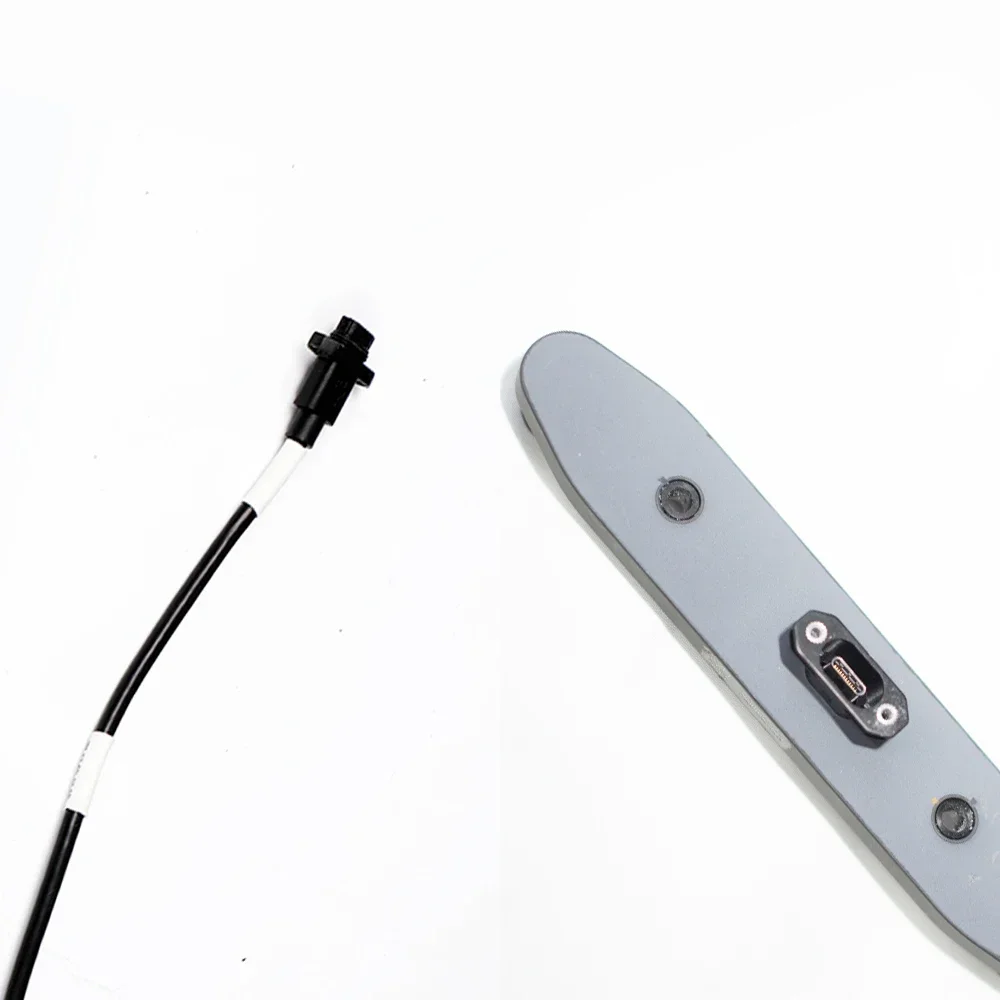 Vue éclatée du module capteur vision avant DJI Agras, montrant les lentilles et le câblage.