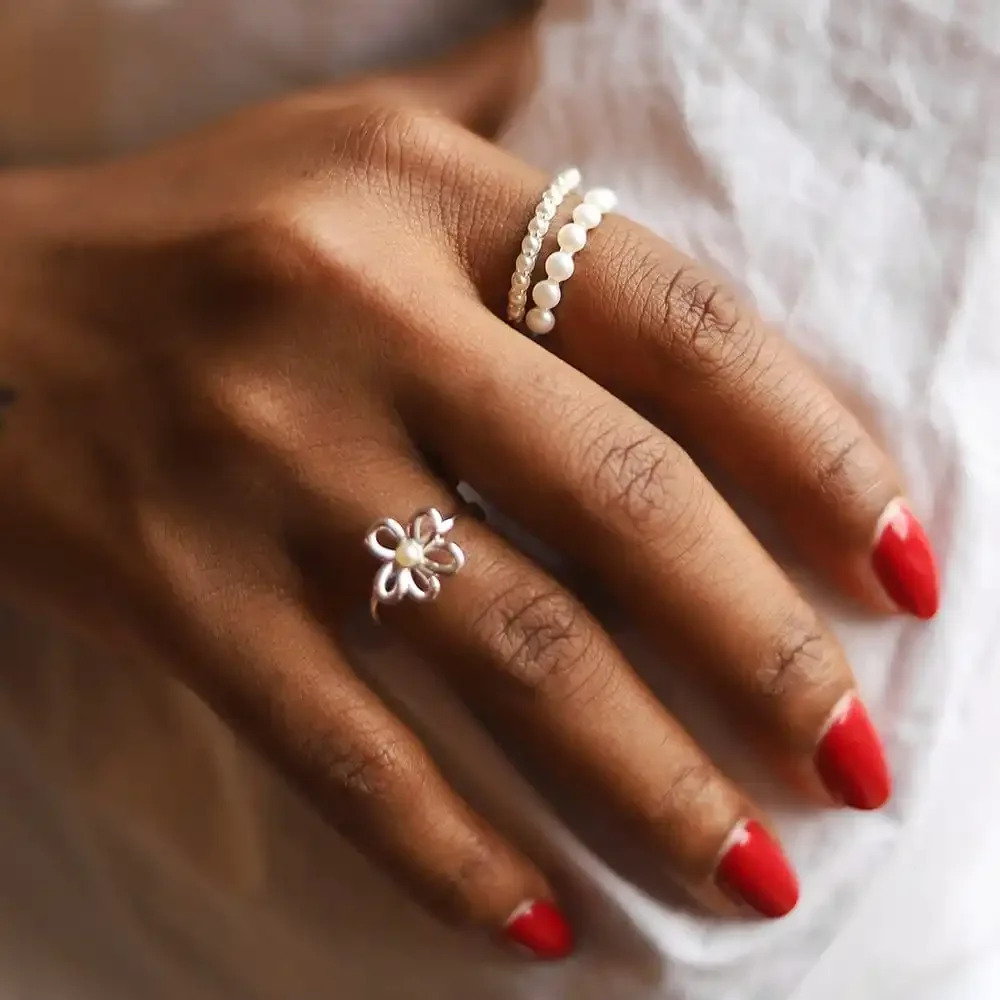 Stylish pearl ring worn on finger for engagement or party occasions