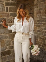 Printemps/été 2026 nouveautés vêtements pour femmes européennes et américaines Style de vacances couleur unie à lacets chemisier brodé 1