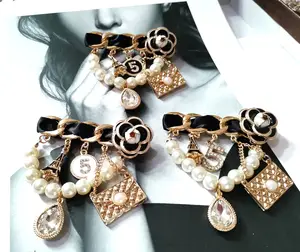 Shop CHANEL Brooches & Corsages by arto_ai