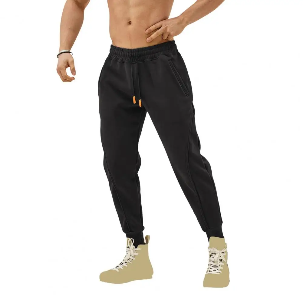 

Повседневные спортивные брюки для мужчин, свободные спортивные штаны с боковыми карманами на щиколотке, эластичная талия на шнурке, для тренировок в тренажерном зале