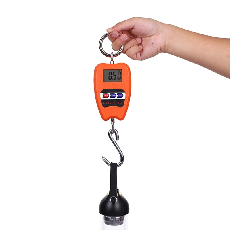 Handheld hanging scale being used