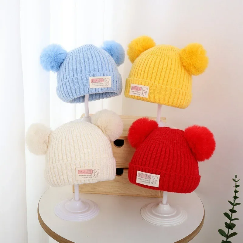 

New simple solid color winter children's warm hat foreign style baby cover hat baby cute double ball hat