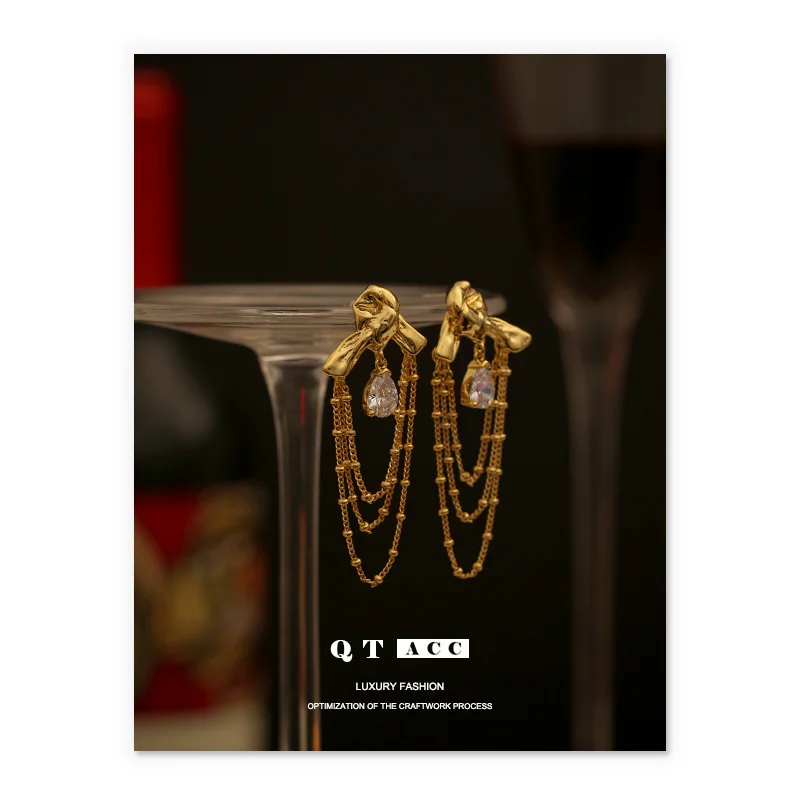 

Brass plated 18K real gold fashion lady style light luxury knot shape water drop shaped zircon tassel earrings female