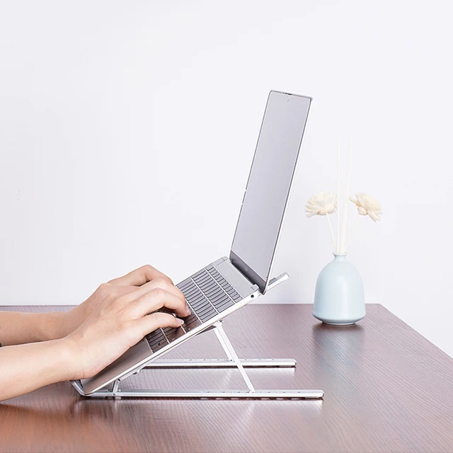 The Laptop Stand Vertical Cooling Aluminum Computer Frame Metal Folding Lifting Monitor Cradle - a superior accessory for optimized laptop usage.