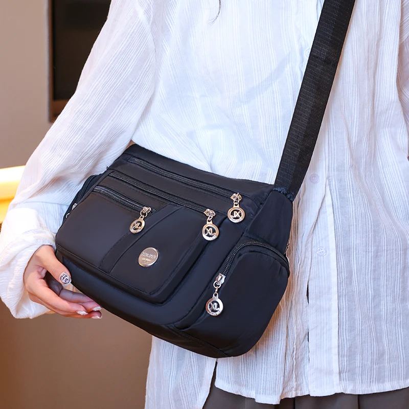 New unisex nylon cloth women's bag Oxford cloth shoulder crossbody bag travel bag Middle aged and elderly multi-layer leisure ba