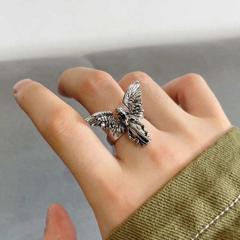 Unisex zinc alloy angel wing ring featuring adjustable opening.