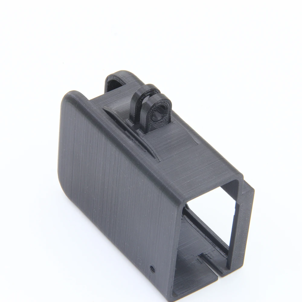 Coque de protection antichoc pour GoPro, étanche, posée sur une surface, vue de côté