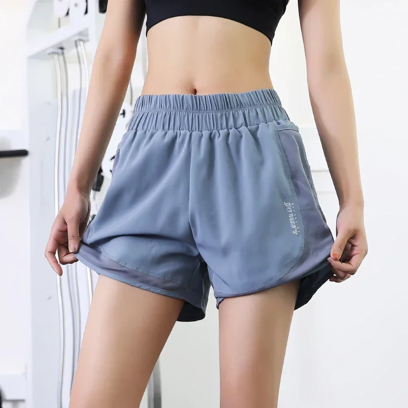 Quick drying shorts anti naked running training outdoor vacation two pieces of net fitness pocket women's sports shorts