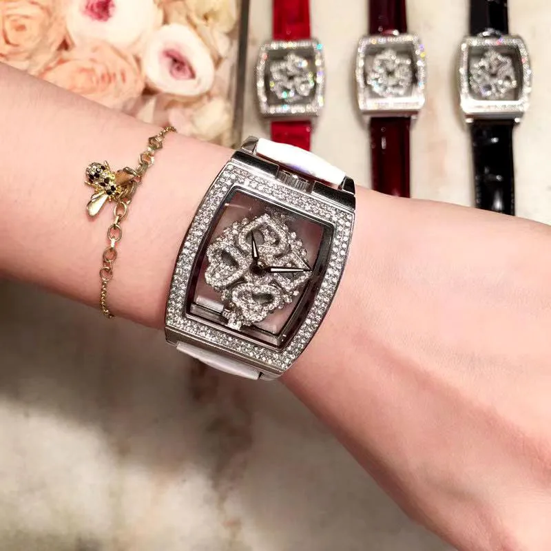 Hoge Kwaliteit Luxe Quartz Horloge Met Strass Draaiende Diamant Gezicht Mode Wit Leer Tonneau Skelet Horloges Voor Vrouwen