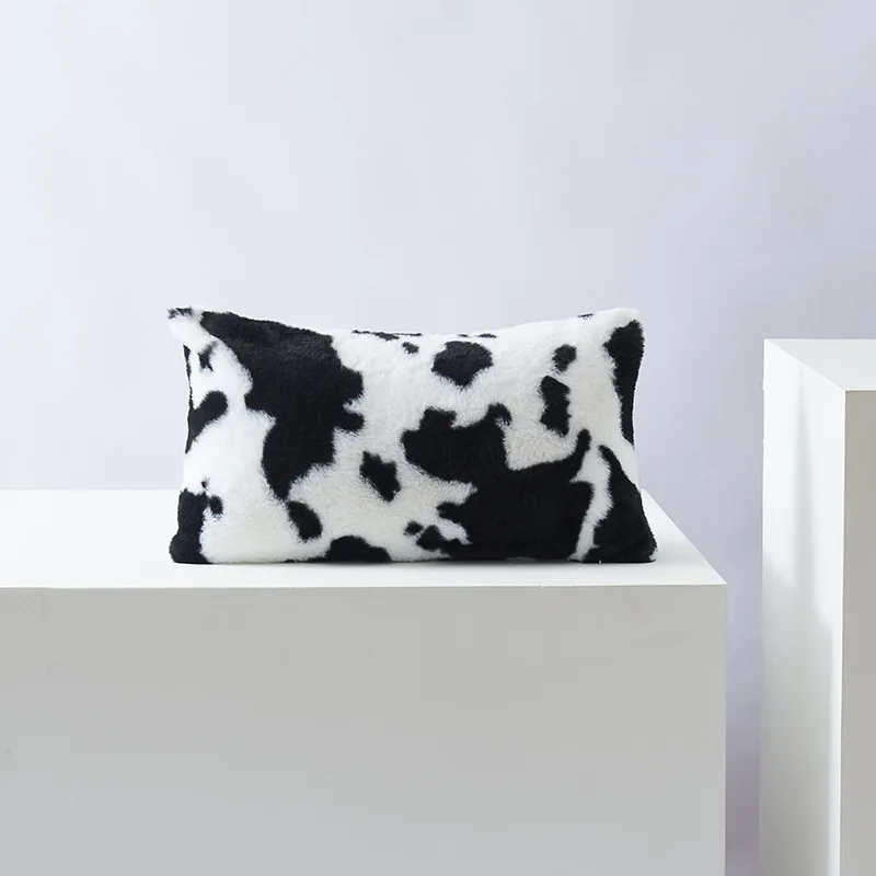 Black and white rectangular lumbar cow-print cover