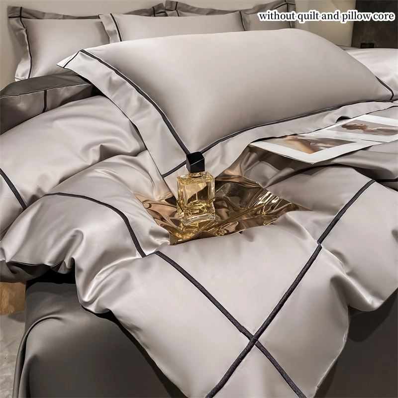 4-Piece Egyptian Cotton Embroidery Bedding Set with solid color design on bed