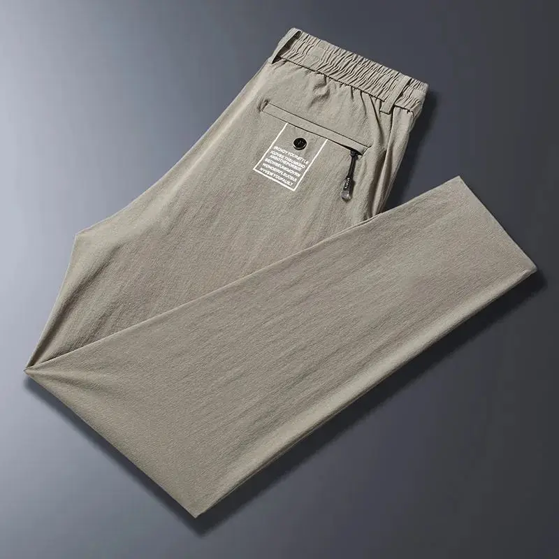 2024 New Summer Men's Ice Shreds Thin Style Trousers Solid Color Elastic Button Zipper Fashionable Loose Casual Harlan Pants