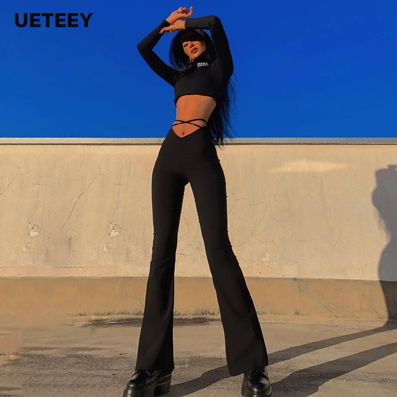 

Hot summer new V-shaped waist with exposed navel cross belt Solid color flare casual pants for women