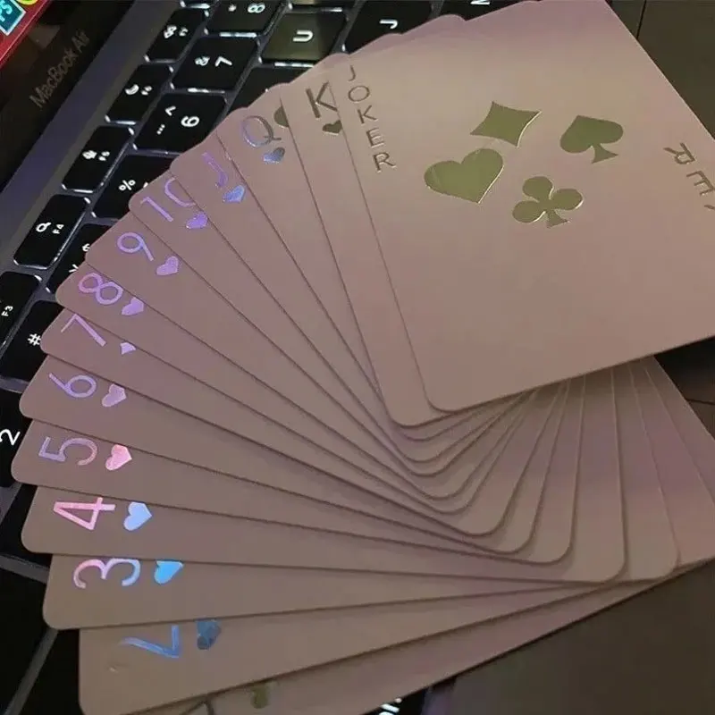 Luminous poker cards displayed on a table with glowing details