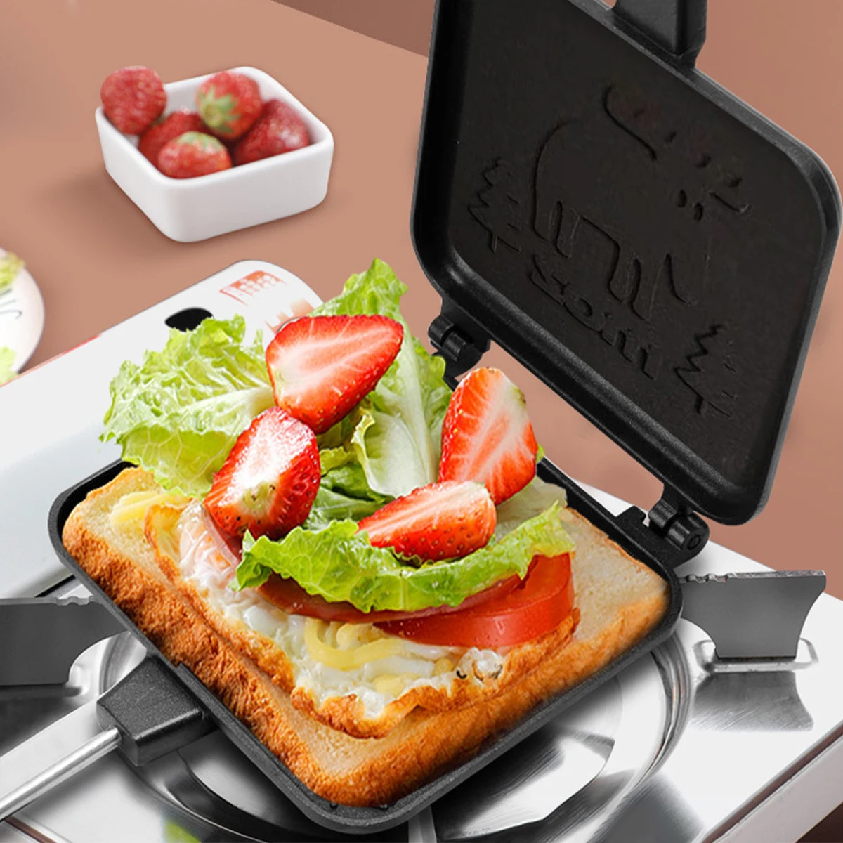 https://ae01.alicdn.com/kf/S452e8d4d75e24b1b9cfd06694abd6fcfY/Toasted-Sandwich-Maker-with-Wooden-Handle-Double-Sided-Sandwich-Grill-Pan-Non-Stick-Stovetop-Toaster-Portable.jpg