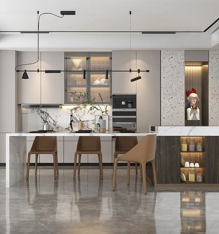 The kitchen features marble countertops, brown chairs, and pendant lighting. A statue and decorative plants adorn the space. Sleek cabinets and appliances accentuate the industrial design, further enhanced by Modern Track Lighting with adjustable heads for targeted illumination.