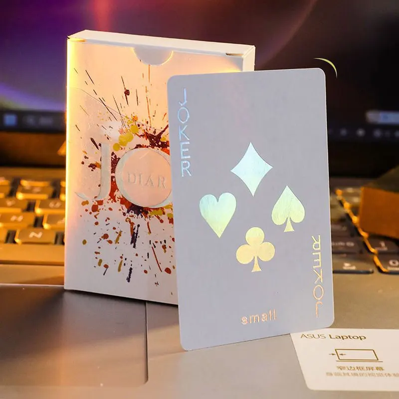 Person holding luminous poker cards during a game