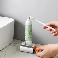 1pc Stainless Steel Wringer Roller Rotate Dispenser for Ointments Cosmetics Bathroom Accessories Toothpaste Squeezer Tube Roller 2
