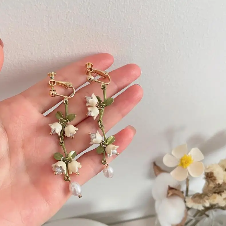 S4687ab31e489443fba62a46669df4083H Elegant White Orchid Flower Earring for Women Ladies Temperament Metal Leaves Long Tassel Drop Earrings Hook Jewelry Accessories Mallzona