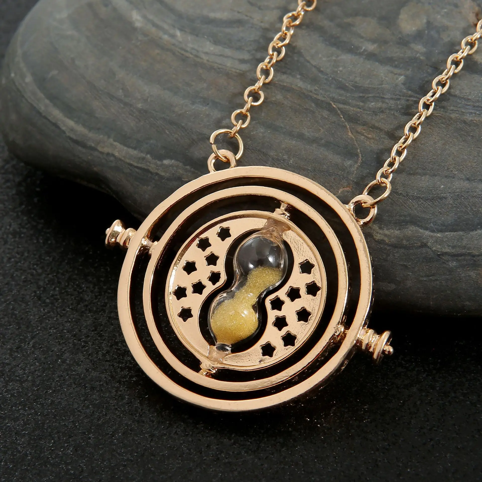 Amazon.com: HARRY POTTER Jewelry - Hermione Time Travel Magical Hourglass  Rotating Necklace, Time Turner, Flash Plated, 22