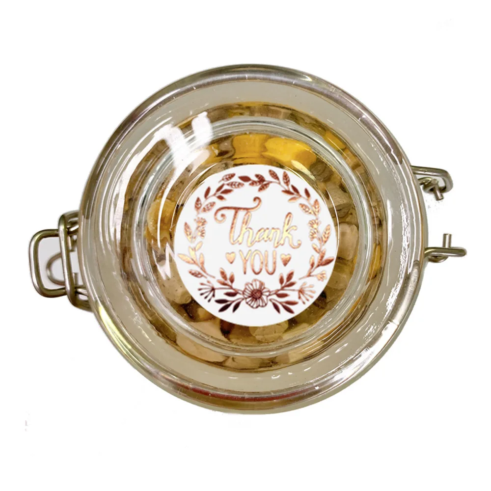 Thank you stickers displayed on gift boxes