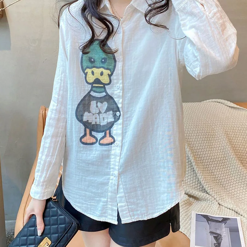 Fashion Printed Cartoon Button Asymmetrical Shirts Female Clothing 2023 Autumn Winter Loose All-match Tops Casual Blouses