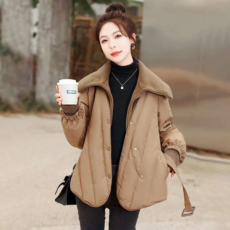 

Winter fashion in 2023 new women's solid color turtleneck coat white duck down short Joker loose stitching warm down jacket.