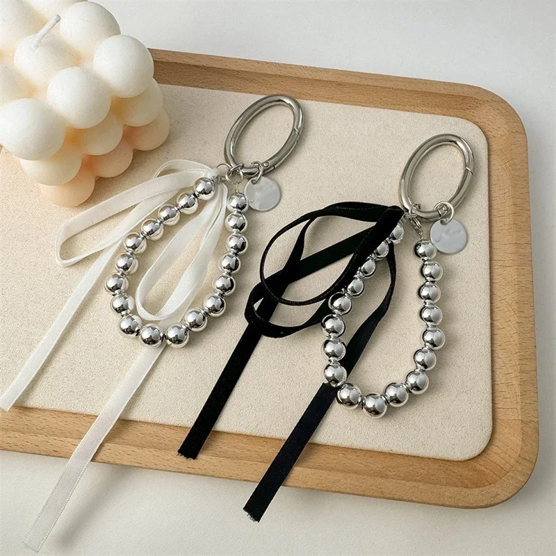 SMUOBT 2 Portachiavi Con Fiocco E Perle Per Donna - Portachiavi Da Polso Per Auto, Accessorio Alla Moda (Bianco)