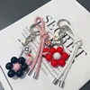 New South Korea Dongdaemun Gentle Cream Colored Leather Rope Contrasting Sun Flower Beads Phone Chain Keychain Bag Pendant 1